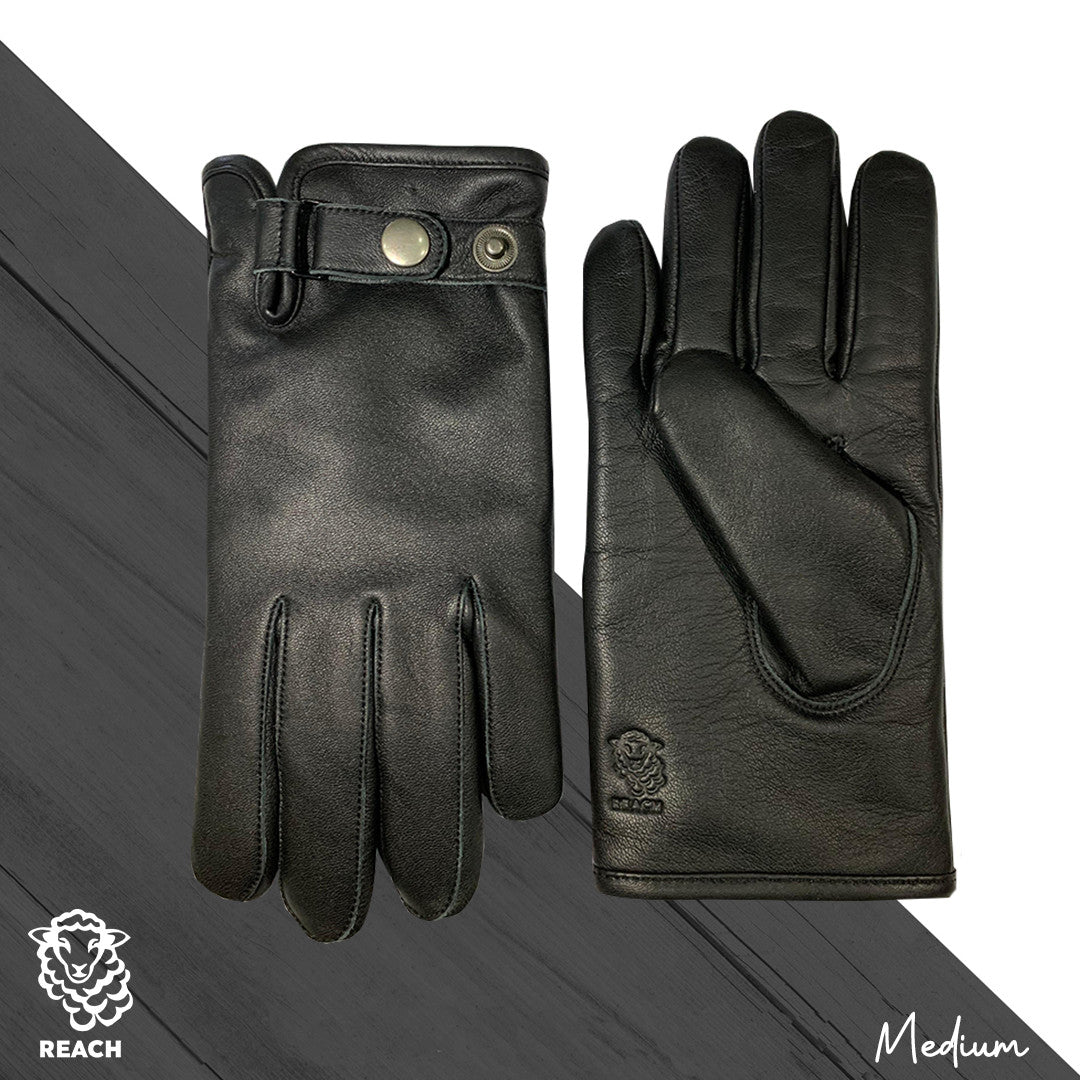 A pair of brown sheepskin leather gloves displayed on a grey background, showing the palm side of the gloves with fastener closure at the wrist.