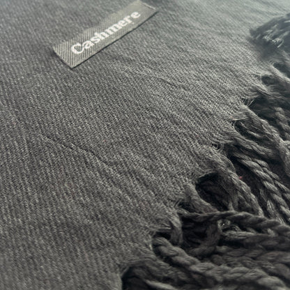 Black scarf with a label on a white background